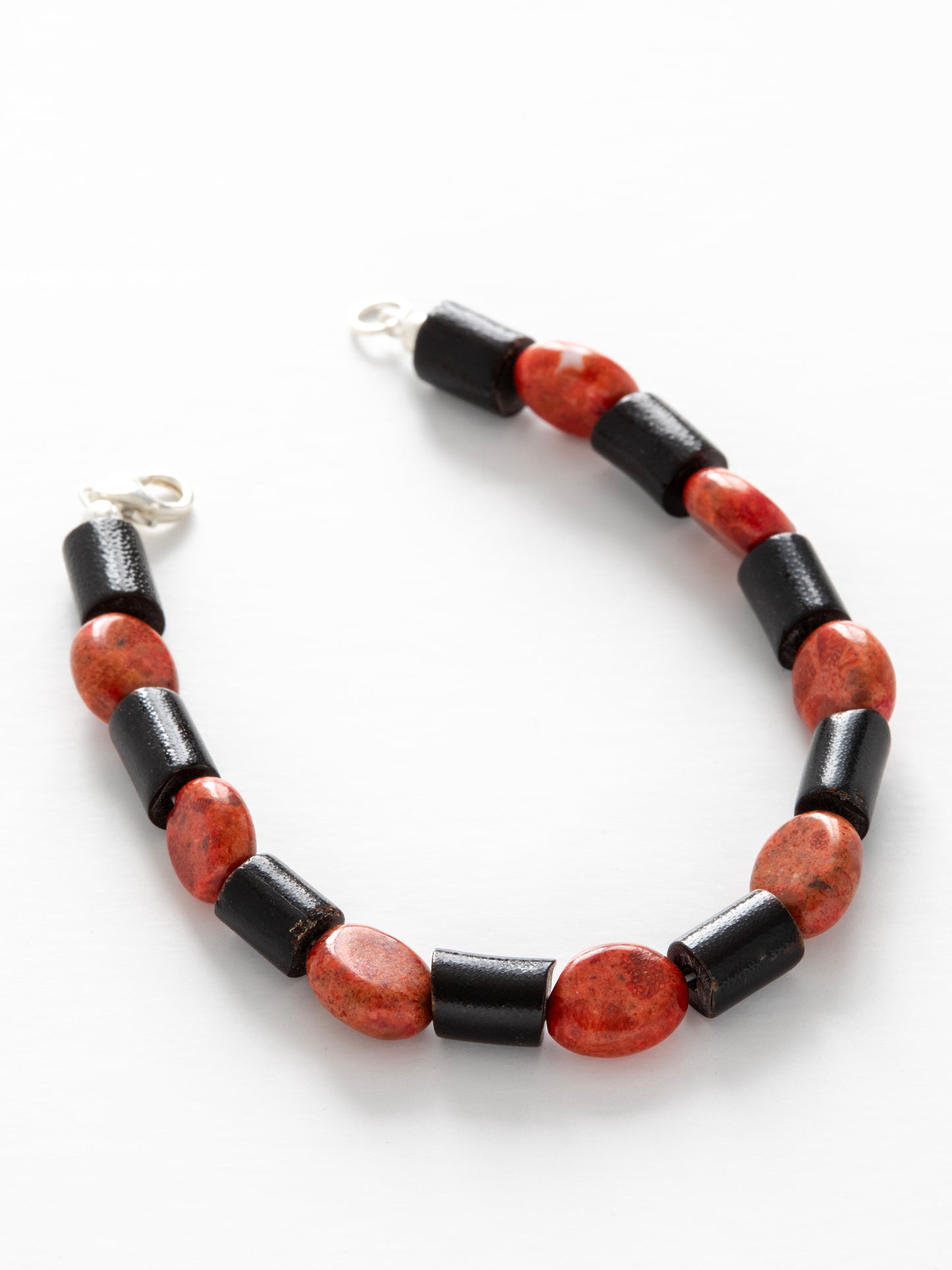 One-of-a-kind natural Red & Black Coral designer bracelet with sterling silver hardware, designed & handmade in California.
