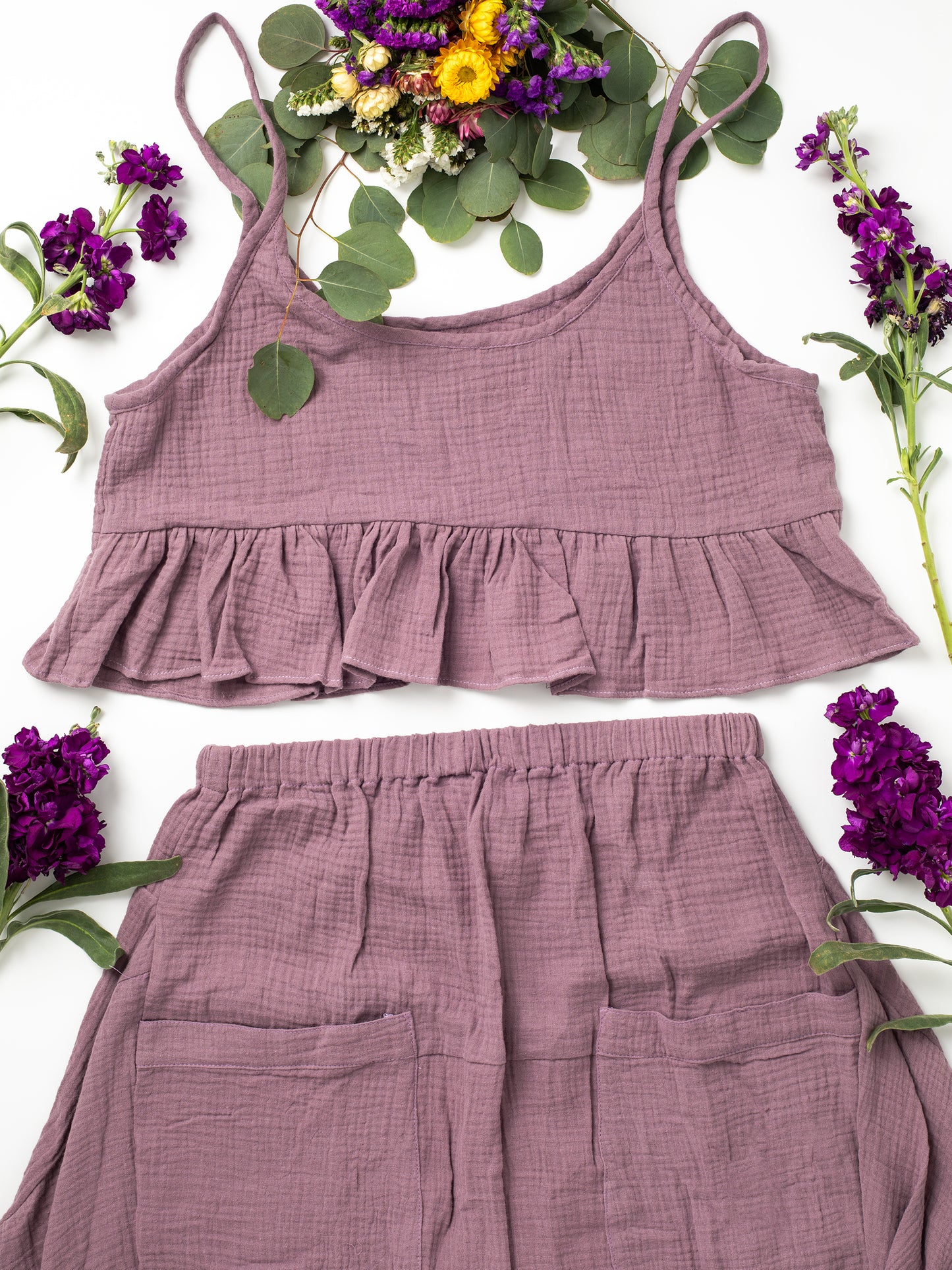 Fun Time Set, Six different colors: Sky Blue, Sage Green, Lavender Purple, Bright White, Golden Yellow, Desert Taupe, Coral Pink, & Jet Black, Easy fit designed to look good on any shape or size, XS, S, M, L, XL, Swingy top looks good snug or loose, Flowy skirt moves with you, Midi or maxi length skirt, depends on your height, V-shaped yoke & slight train in the back, Large patch pockets on front of skirt, 100% Organic Cotton Double Gauze,
Designed & Made in California.