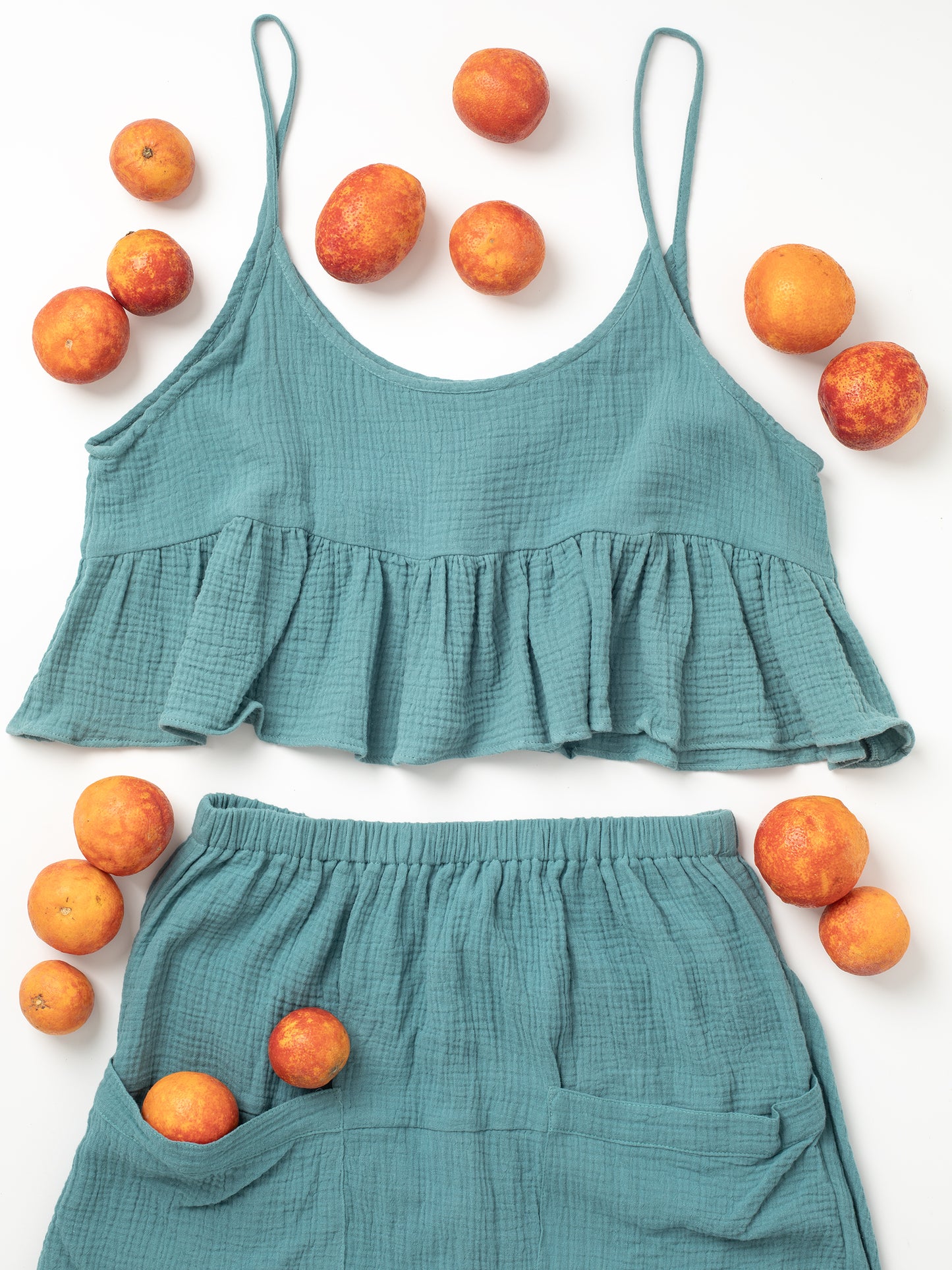 Fun Time Set, Six different colors: Sky Blue, Sage Green, Lavender Purple, Bright White, Golden Yellow, Desert Taupe, Coral Pink, & Jet Black, Easy fit designed to look good on any shape or size, XS, S, M, L, XL, Swingy top looks good snug or loose, Flowy skirt moves with you, Midi or maxi length skirt, depends on your height, V-shaped yoke & slight train in the back, Large patch pockets on front of skirt, 100% Organic Cotton Double Gauze,
Designed & Made in California.