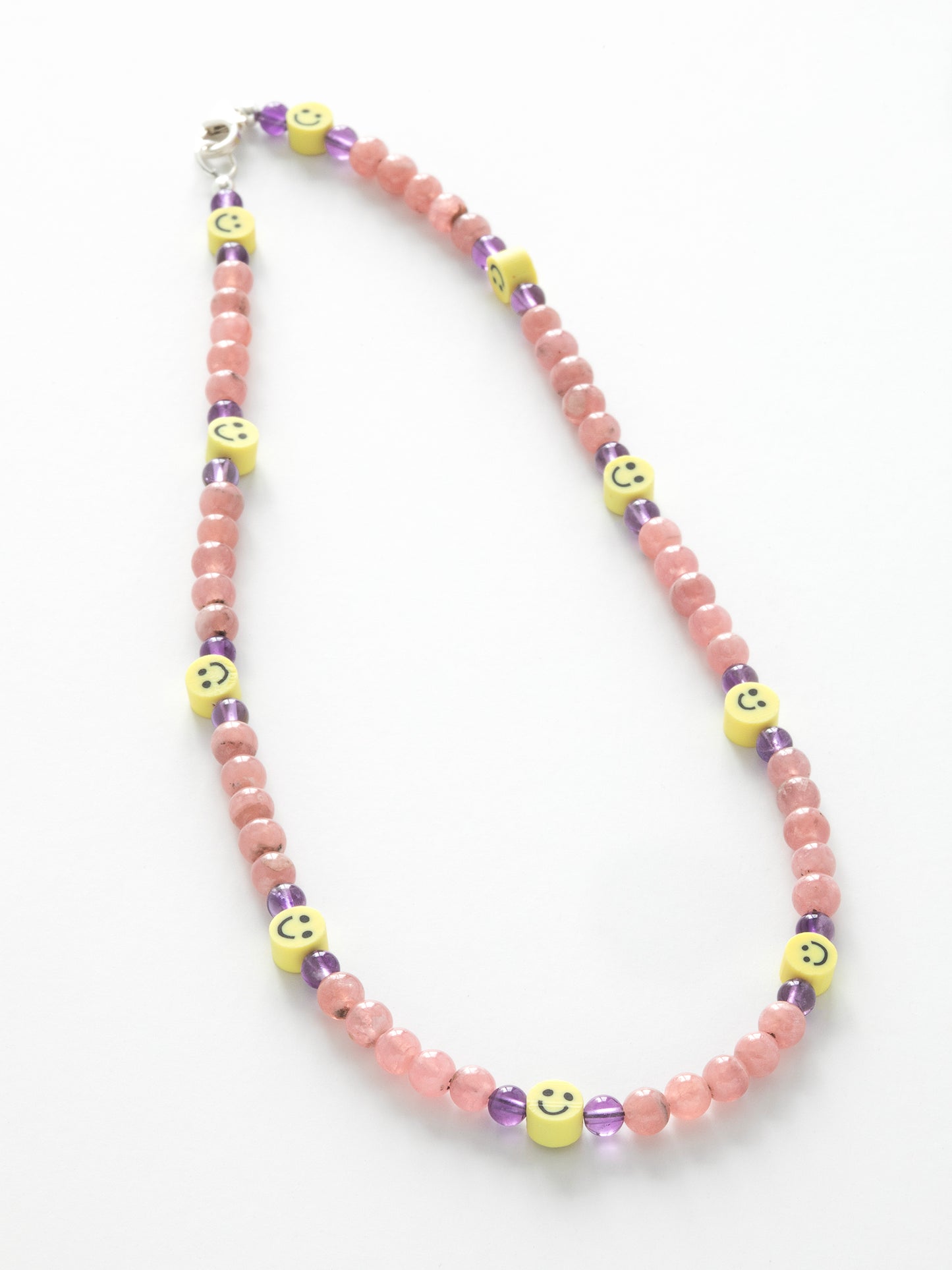 One-Of-A-Kind statement choker necklace lovingly designed & handmade in California using Amethyst, Rhodochrosite, Polymer Clay beads, & a Sterling Silver clasp. Stones are connected to Capricorn, Pisces, Aquarius, Virgo, Scorpio, & Leo signs, & this piece is designed to unite the Heart & Crown Chakras.