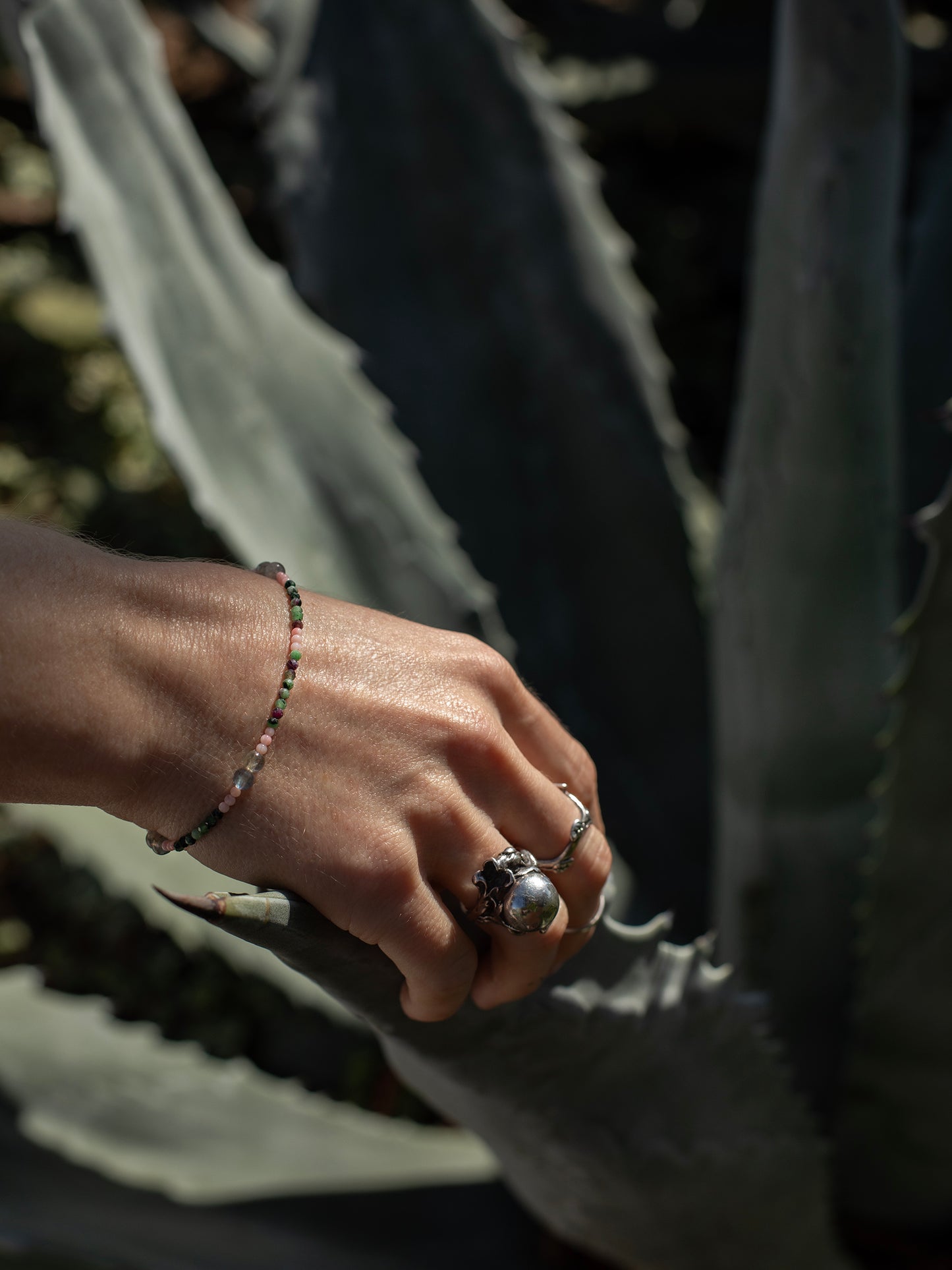 One-of-a-kind natural Labradorite, Pink Coral, & Ruby Zoasite designer bracelet with sterling silver hardware, designed & handmade in California.