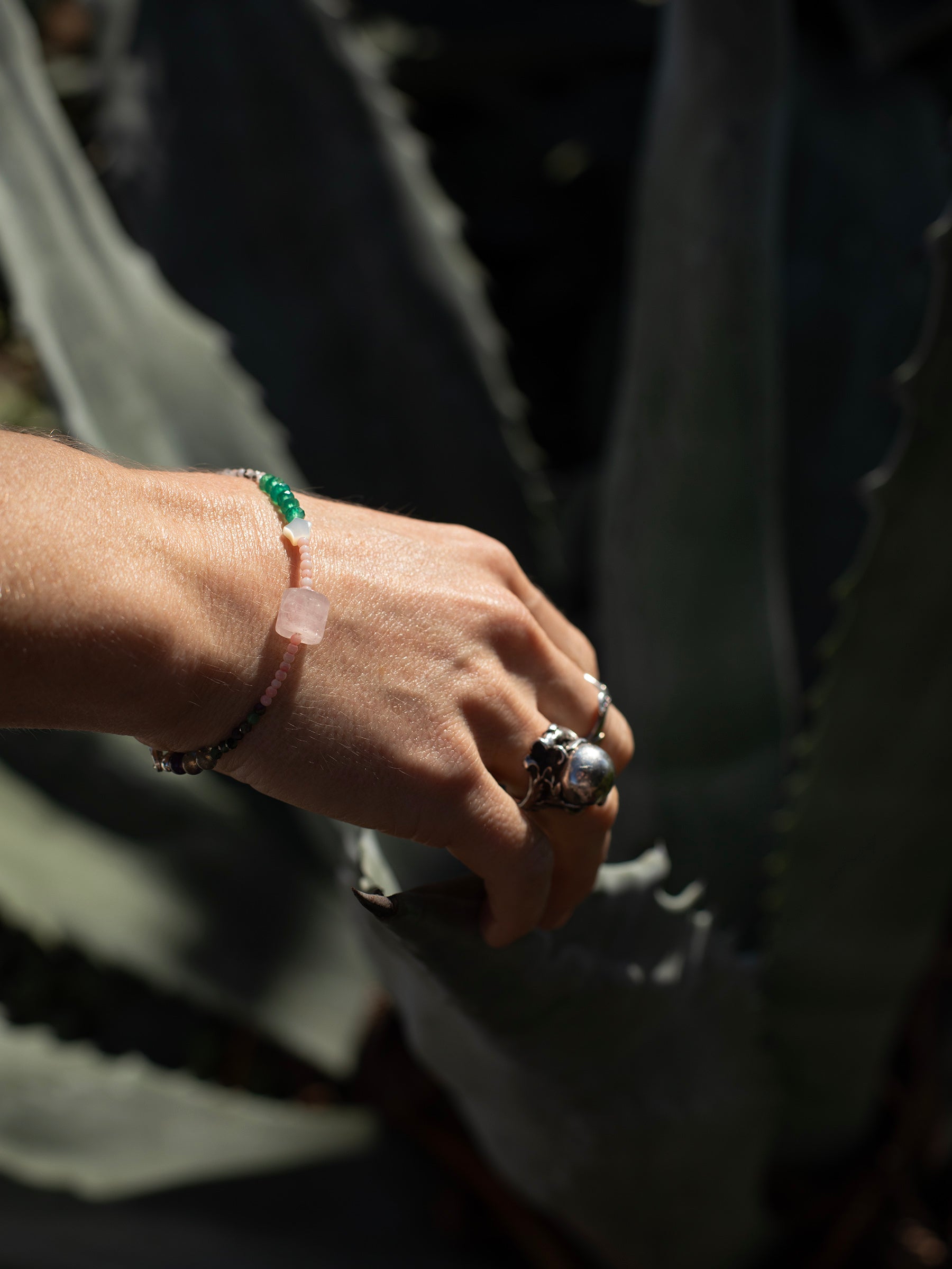 One-of-a-kind Amazonite, Amethyst, Aventurine, Labradorite, Malachite, Moonstone, Mother of Pearl, Pink Coral, Rose Quartz, & Ruby Zoisite designer bracelet with sterling silver hardware, designed & handmade in California.