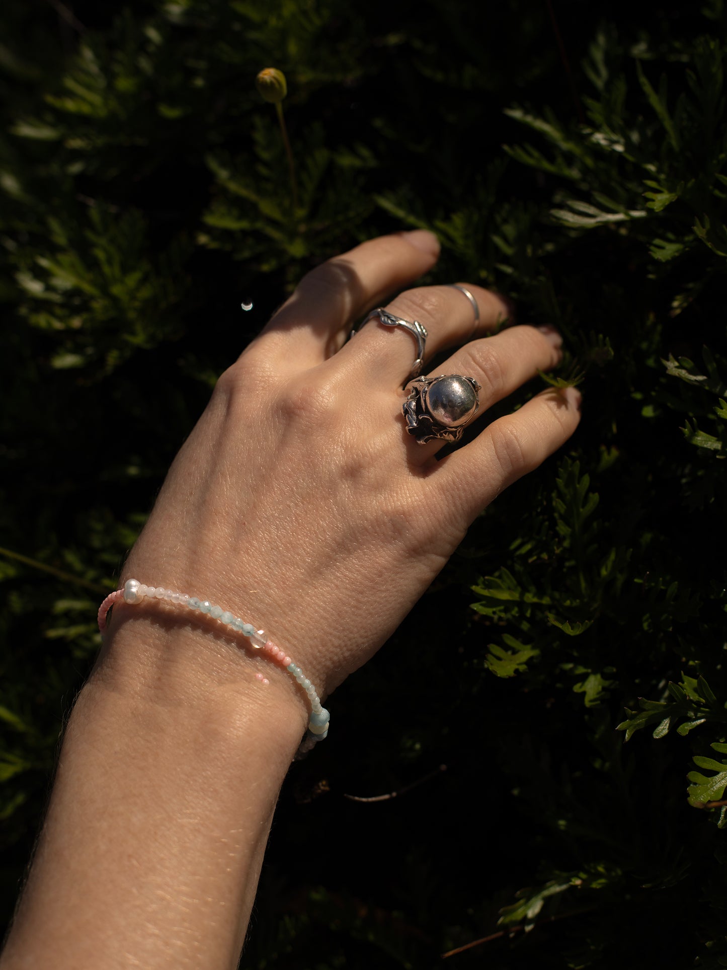 One-of-a-kind natural crystal designer bracelet with sterling silver hardware, designed & handmade in California. Stones are Amazonite, Freshwater Pearl, Labradorite, Morganite, Pink Coral, & Rose Quartz.