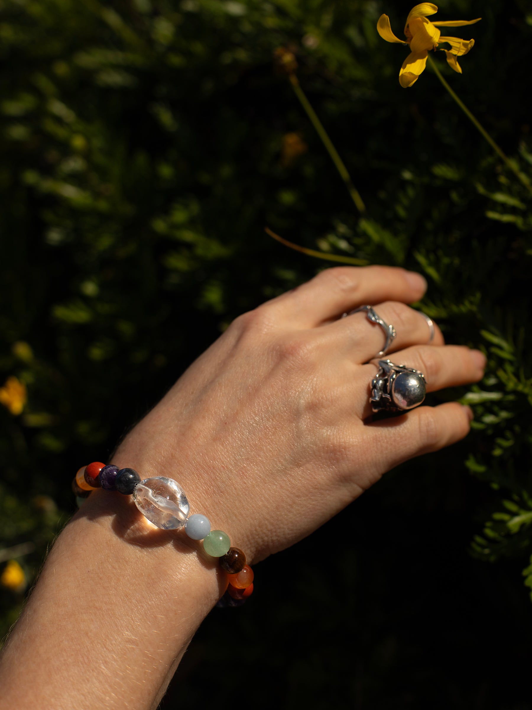 One-of-a-kind Amethyst, Aventurine, Blue Calcite, Blue Lapis, Carnelian, Quartz, Red Jasper, & Tiger's Eye designer bracelet with sterling silver hardware, designed & handmade in California.