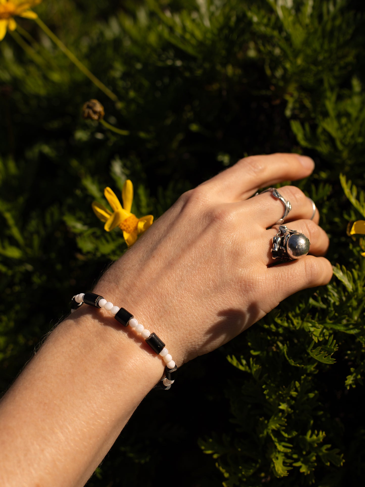 One-of-a-kind natural Black Coral & Mother of Pearl designer bracelet with sterling silver hardware, designed & handmade in California.