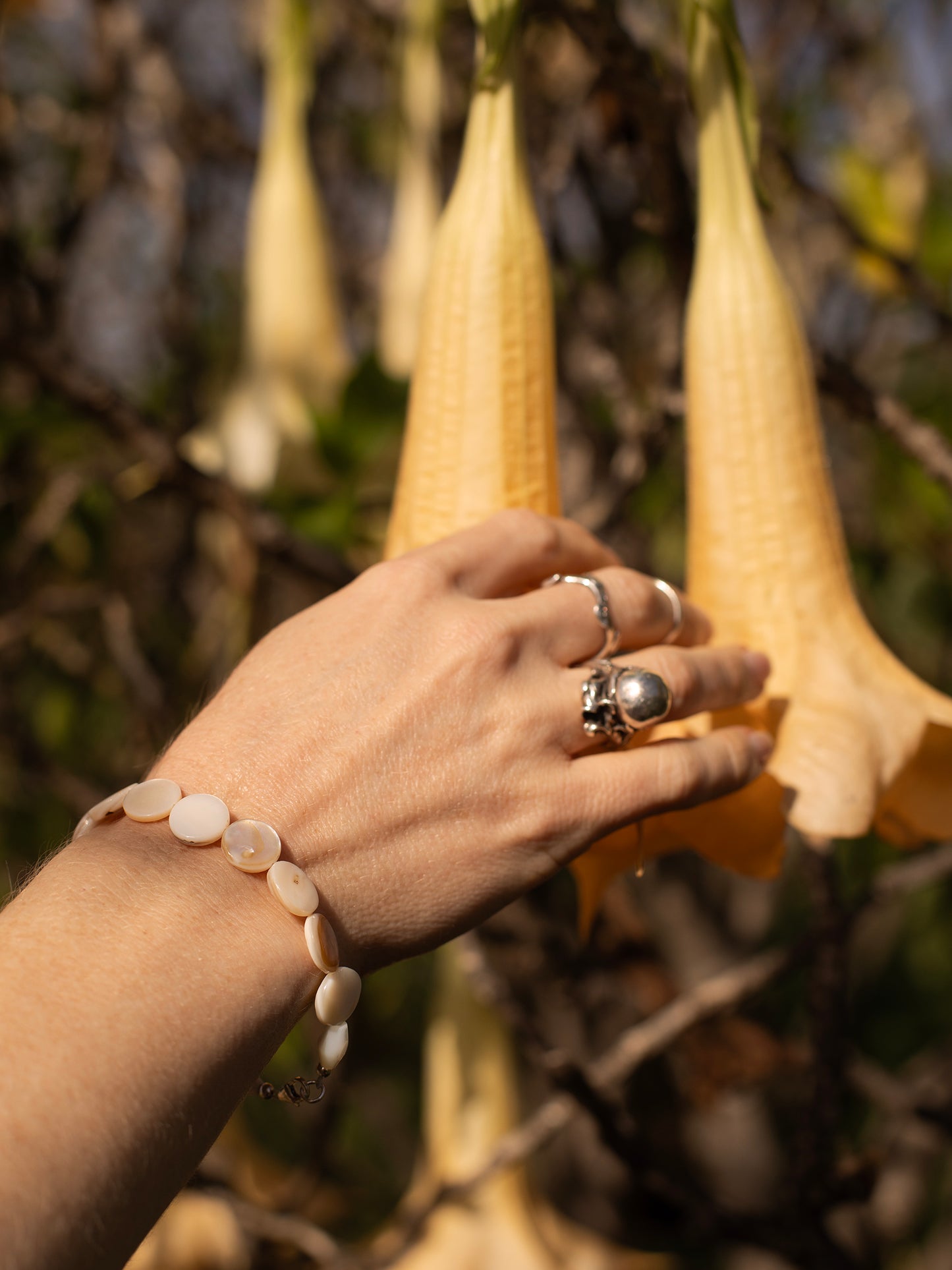 One-of-a-kind natural Mother of Pearl shell designer bracelet with sterling silver hardware, designed & handmade in California.