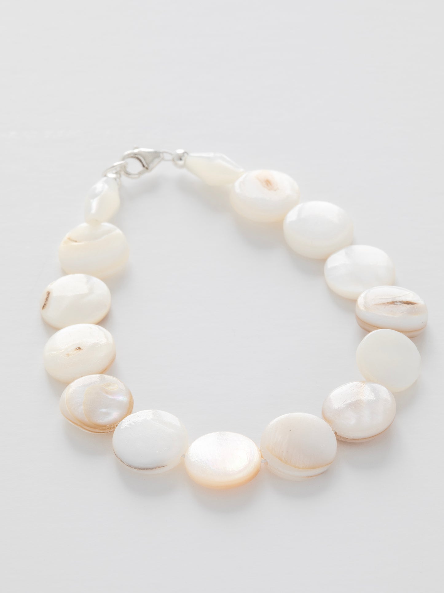 One-of-a-kind natural Mother of Pearl shell designer bracelet with sterling silver hardware, designed & handmade in California.