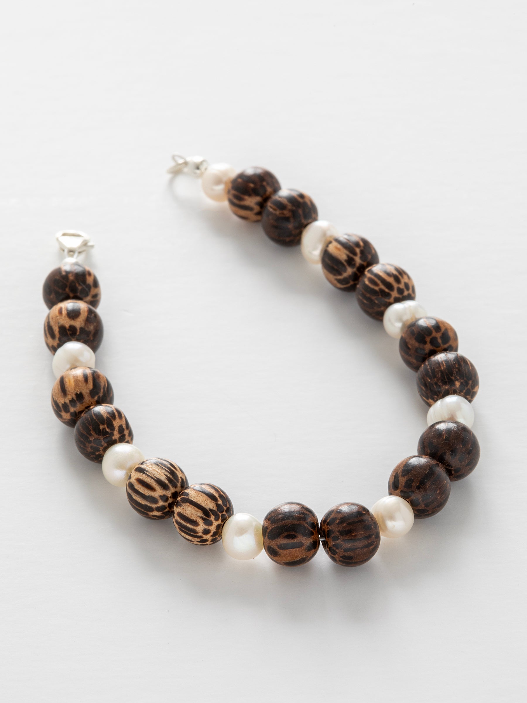 One-of-a-kind natural Pearl & Coconut Shell designer bracelet with sterling silver hardware, designed & handmade in California.