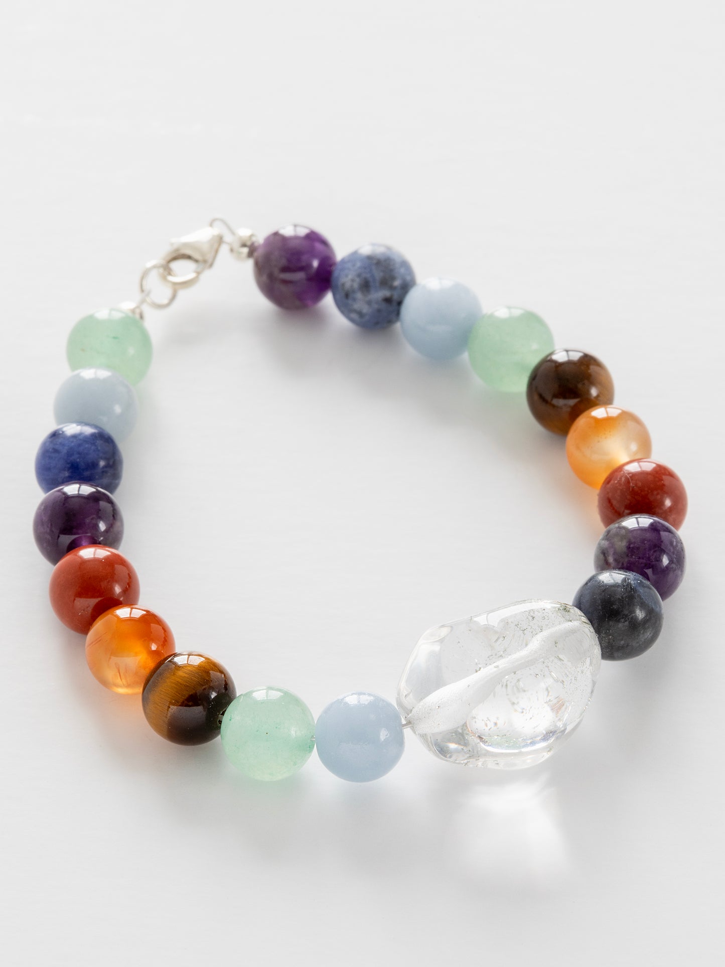 One-of-a-kind Amethyst, Aventurine, Blue Calcite, Blue Lapis, Carnelian, Quartz, Red Jasper, & Tiger's Eye designer bracelet with sterling silver hardware, designed & handmade in California.