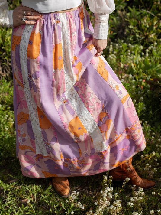 Vintage Psychedelic Pink & Lavender Patchwork Cotton Skirt, Lavender, Pink, Vibrant Orange, & Cream colors, Mid Century, 1960s, Definitely homemade, with each panel a different color, Vibrant Summer of Love floral print on cotton, Cotton Lace paneling, Hidden elastic waistband, Sourced in California.