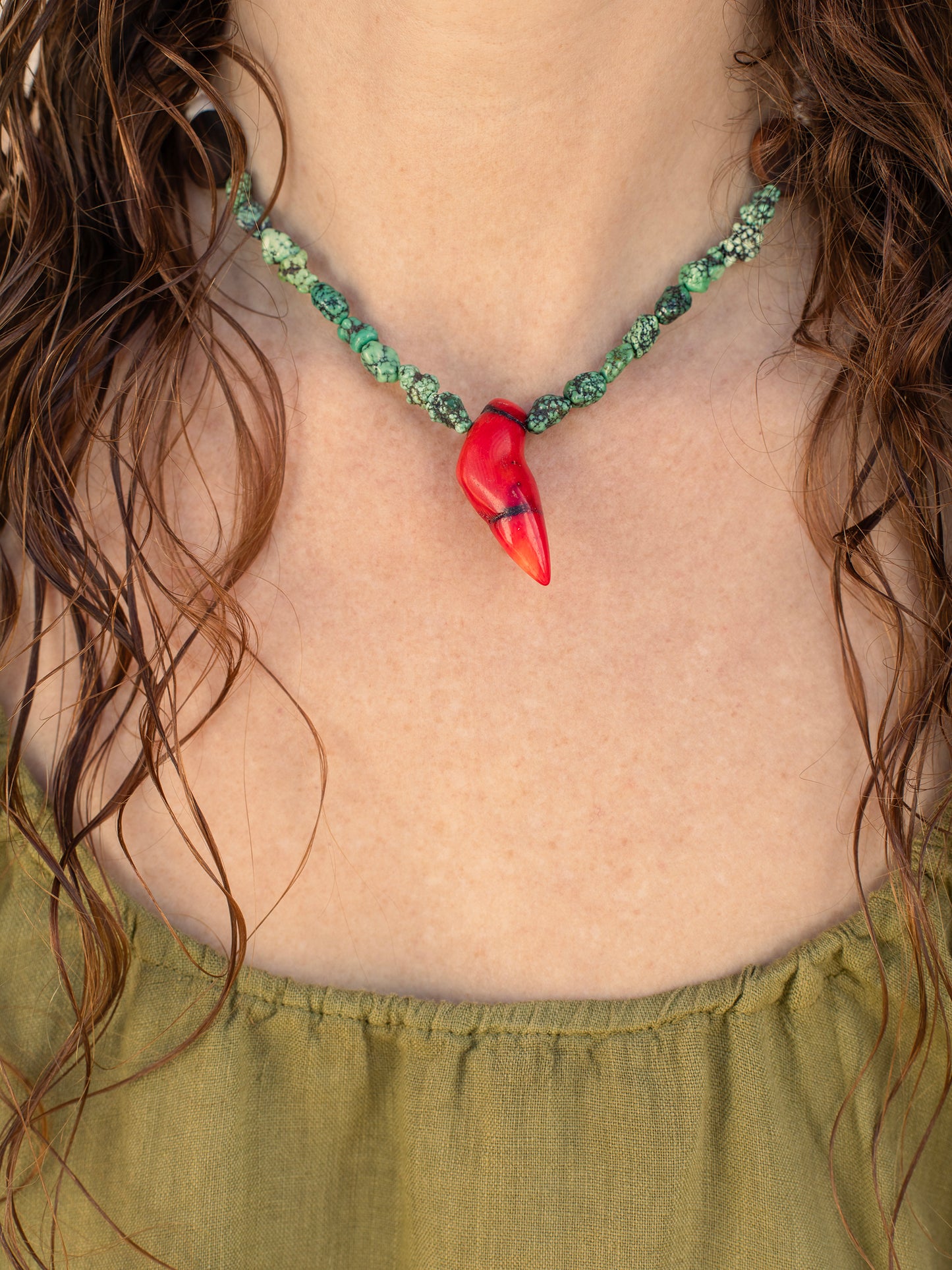 One-of-a-kind natural stone, shell, & wood designer bracelet with sterling silver hardware, designed & handmade in California. Stones & shells include Coconut Shells, Natural Puka Shells, Red Coral, & Turquoise.