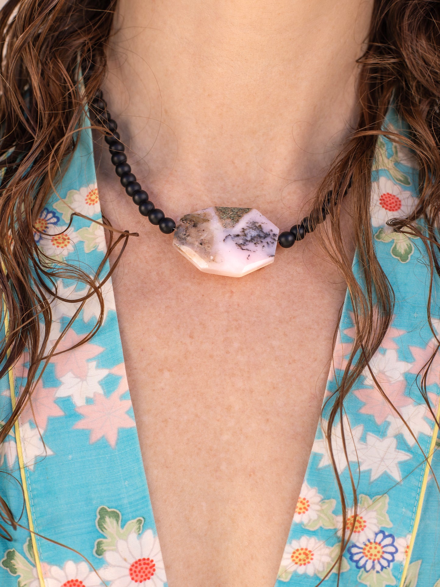 One-of-a-kind natural crystal designer bracelet with sterling silver hardware, designed & handmade in California. Crystals include Black Lava Rock &
Rhodonite.