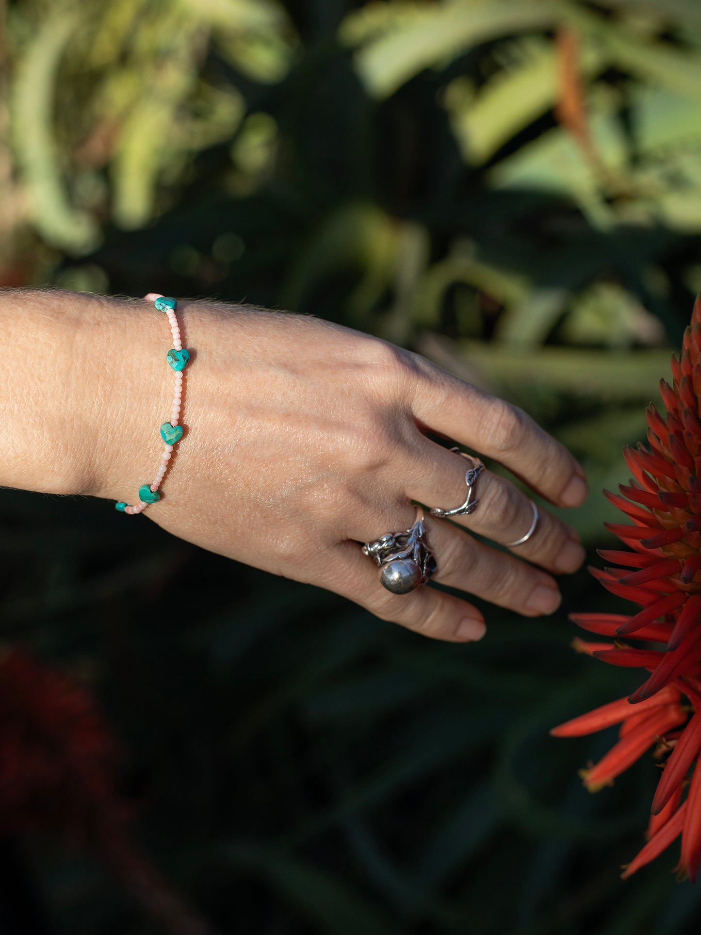 One-of-a-kind natural Turquoise crystal & Pink Coral shell designer bracelet with sterling silver hardware, designed & handmade in California.