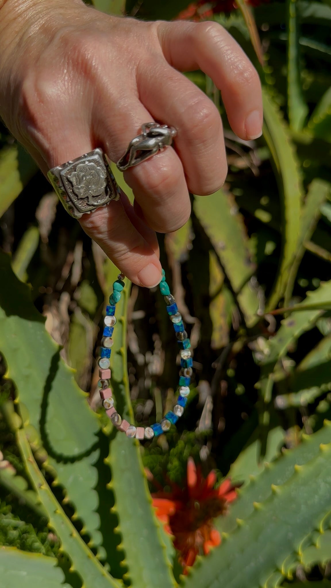 One-of-a-kind natural crystal & shell designer bracelet with sterling silver hardware, designed & handmade in California. Crystals & shells include Abalone, Azurite, Malachite, Rhodonite, & Turquoise.