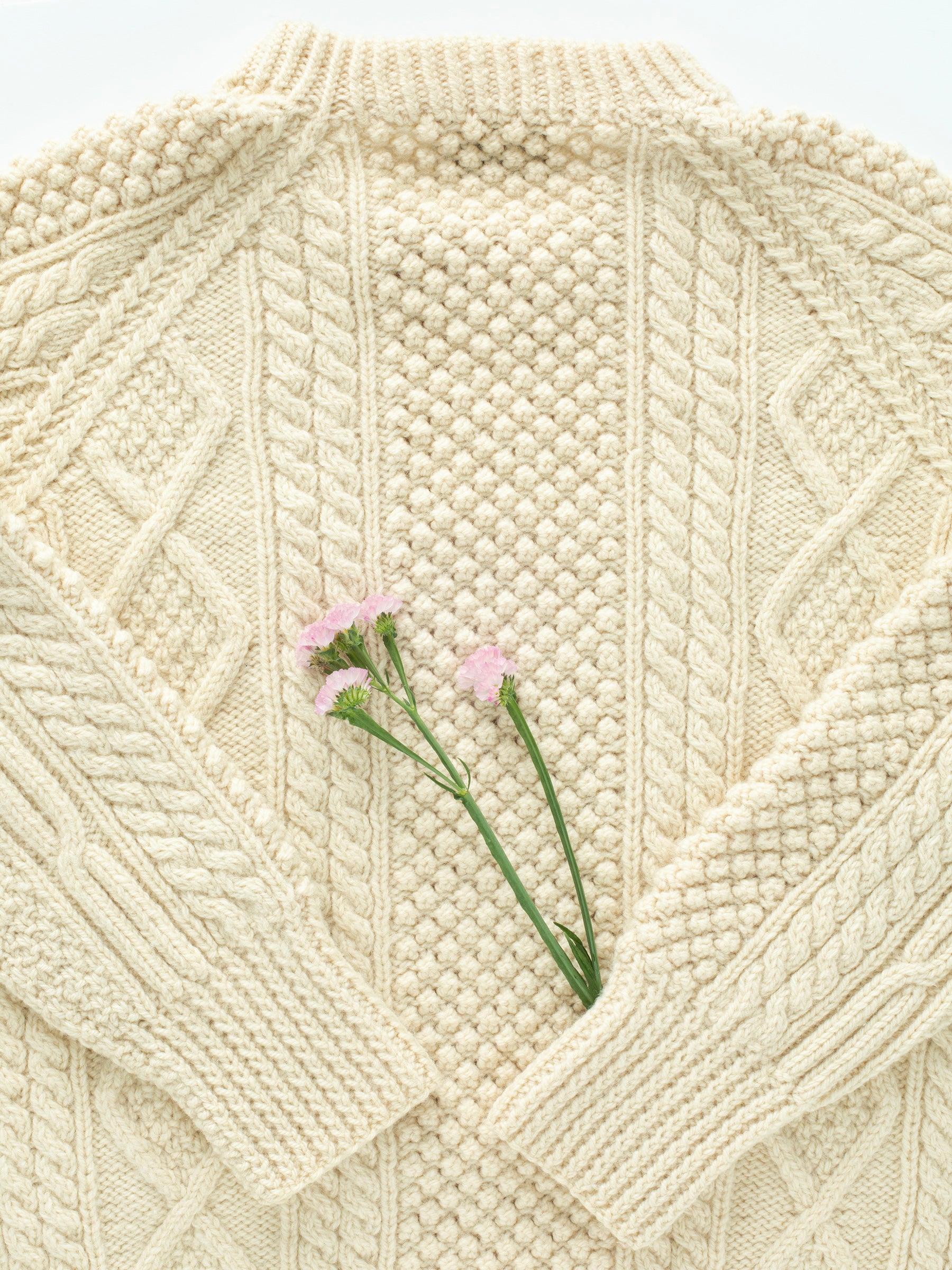 Vintage Cream-Colored Fisherman's Cableknit Irish Wool Sweater (1960s), Cream color, Coughlin Clan Pattern, Brand tag "Irish Cottage Industries LTD. 18 Dawson Street, Dublin" Fits modern Women's S/M, No size tag, 100% Pure Wool, Made in Ireland.