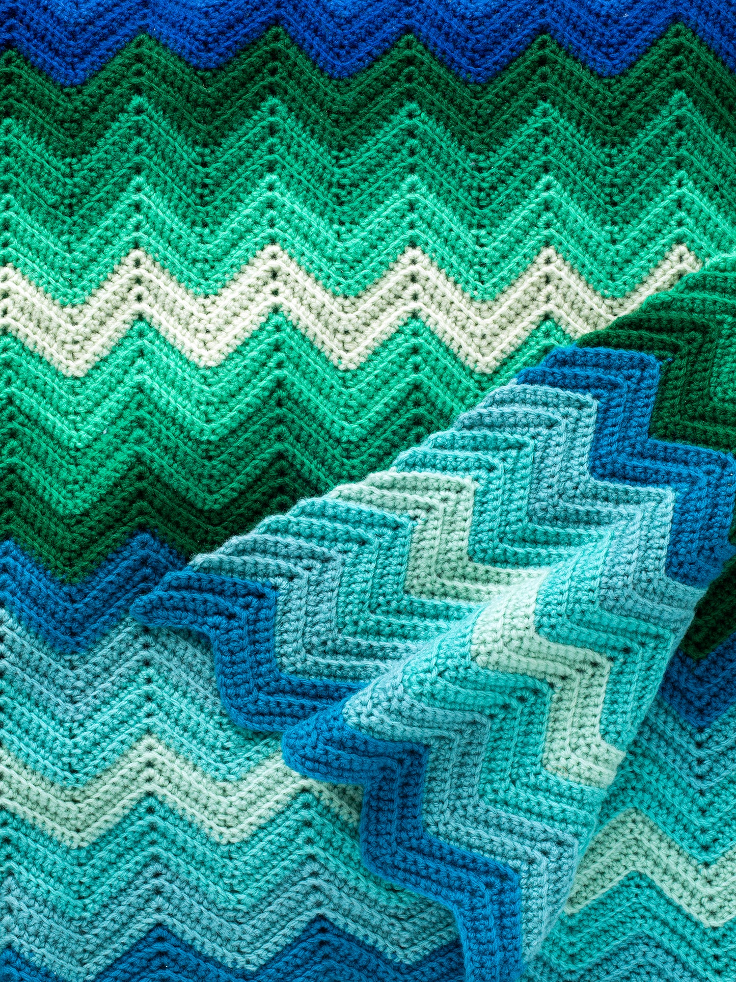 Vintage Blue & Green Chevron Striped Handmade Crochet Afghan Blanket in blue, green, & turquoise, 12 different shades total. One-of-a-kind, hand-knit, synthetic yarn, sourced in California, made in USA, 80in x 52in (203.2cm x 132.08cm).