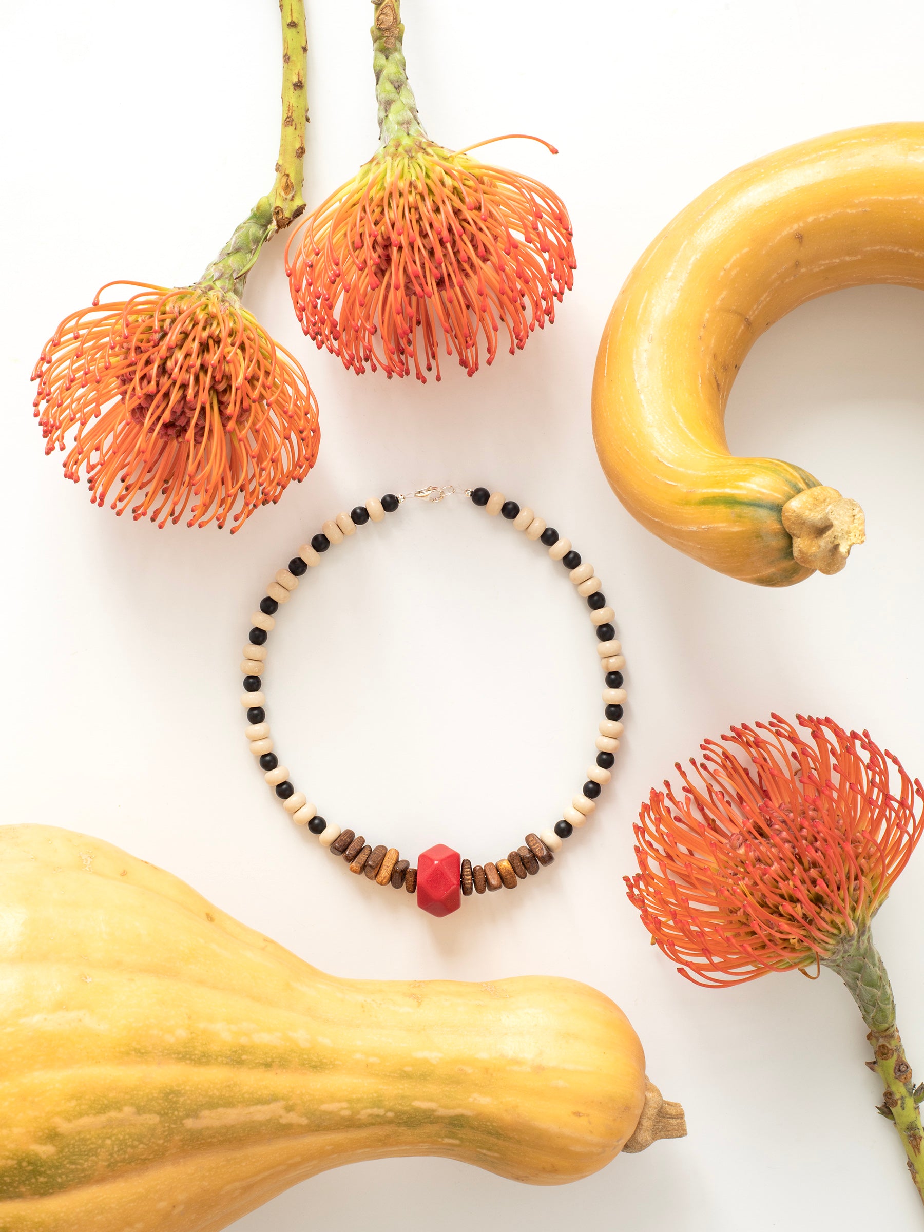 One-of-a-kind natural Howlite, Onyx, Red Coral, & Wood designer bracelet with sterling silver hardware, designed & handmade in California.