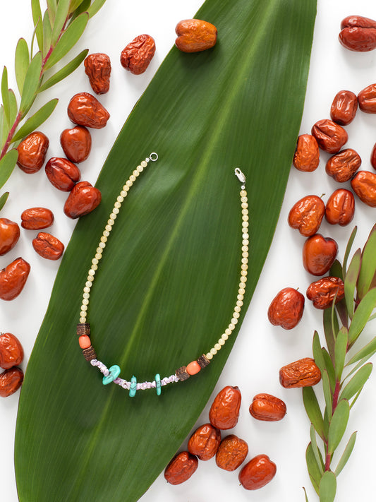 San Juan del Sur Necklace, Buri Seeds, Citrine, Coconut Shells, Natural Shells, Turquoise, Sterling Silver clasp, One-of-a-kind, Designed & handmade in California. The lavender-hued spirals of Natural Shells represent the beautiful journey of life, while cubes of Coconut Shells symbolize the Sacred Geometry that lives all around us. Yellow Citrine calls to abundance & wealth, & it is believed Turquoise can act as a source of protection. Unifies the Solar Plexus & Throat Chakras.