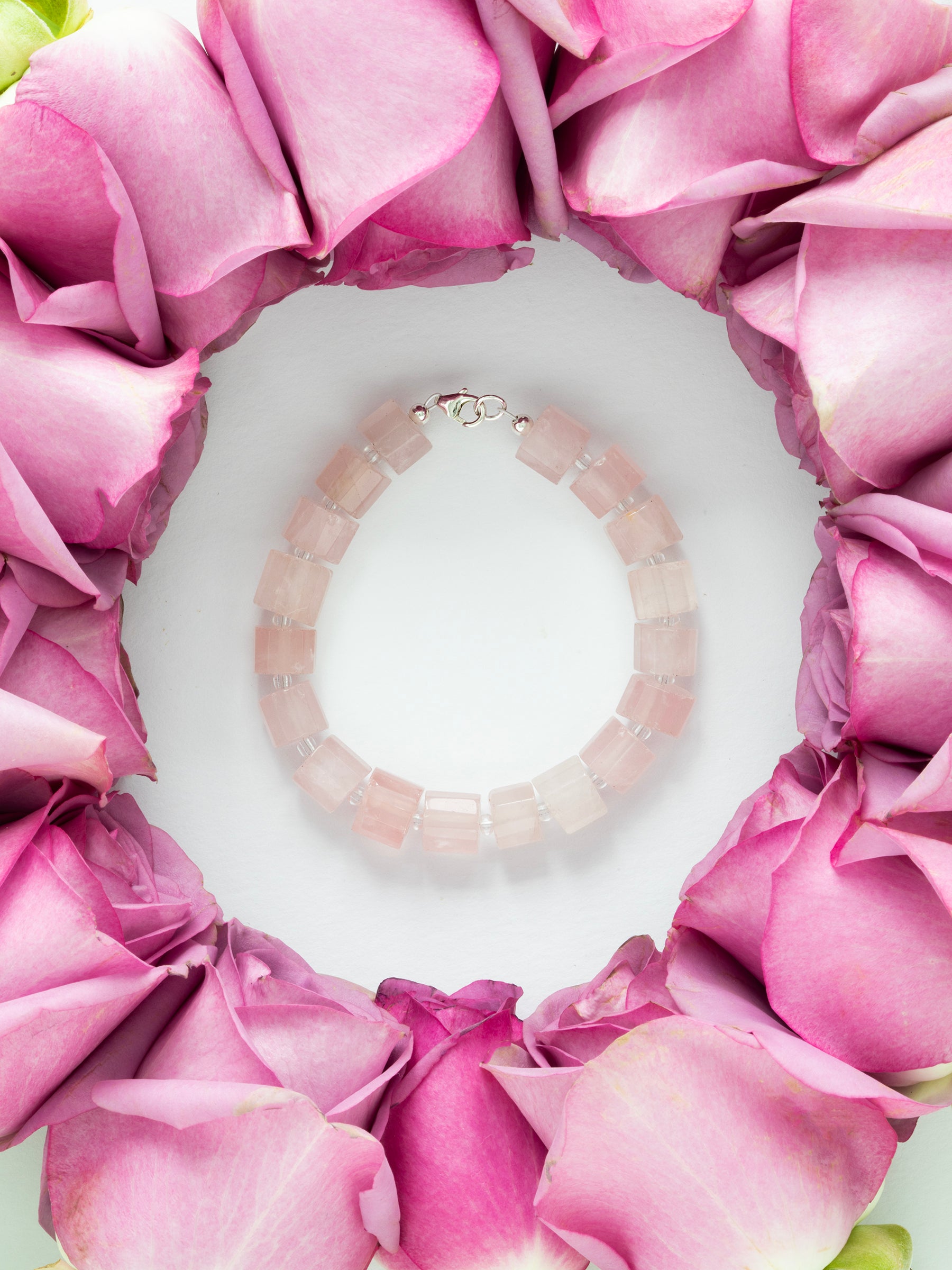 One-of-a-kind natural crystal designer bracelet with sterling silver hardware, designed & handmade in California. Crystals include Quartz & Rose Quartz.