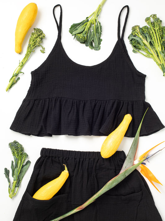 Fun Time Top in Jet Black - Comes in 6 different colors: Sky Blue, Sage Green, Lavender Purple, Bright White, Golden Yellow, Desert Taupe, Coral Pink, & Jet Black, Easy fit designed to look good on any shape or size, XS, S, M, L, XL, 100% Organic Cotton Double Gauze. Designed & Made in California.