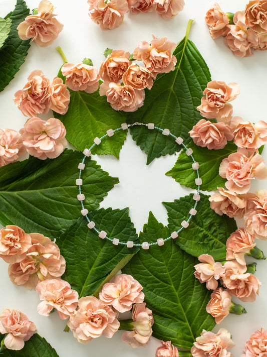 Natural crystal statement choker necklace featuring Aquamarine & Rose Quartz with a Sterling Silver clasp is giving ocean vibes. Release your inner mermaid, & go for a swim! Caring is cool, & Future Love is forever.