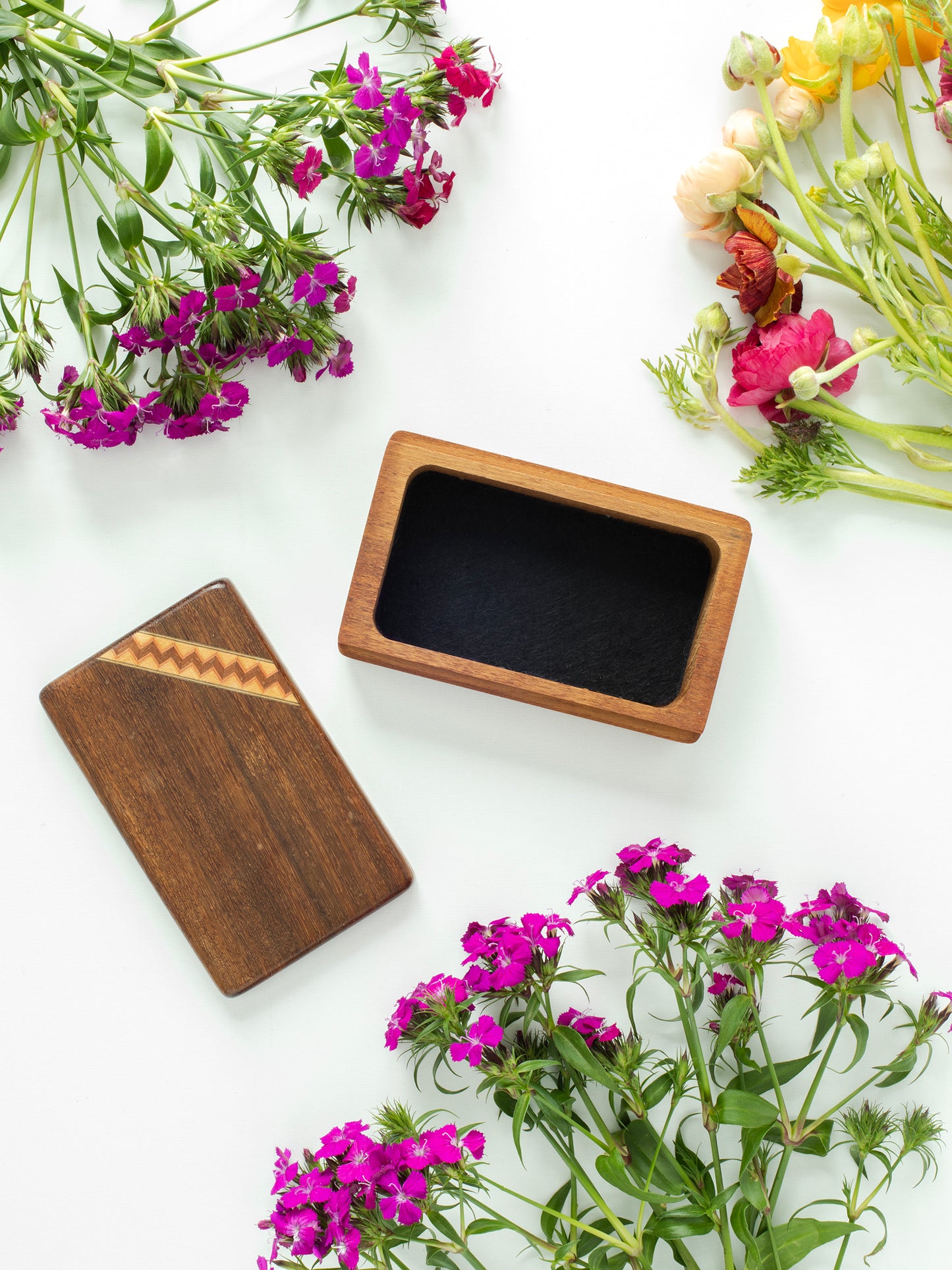 Vintage MCM Multicolor Wood Marquetry Stash Box, Zigzag Pattern, Rich Brown colors, Mid Century, 1950s-1960s,
Top is African Red Padauk Wood, Bottom is Teak Wood, Like new, Top slides open to reveal stash container, Inside bottom lined in felt, Height 6in (15.24cm), Width 3.75in (9.53cm), Depth 1.75in (4.45cm), Sourced in California.