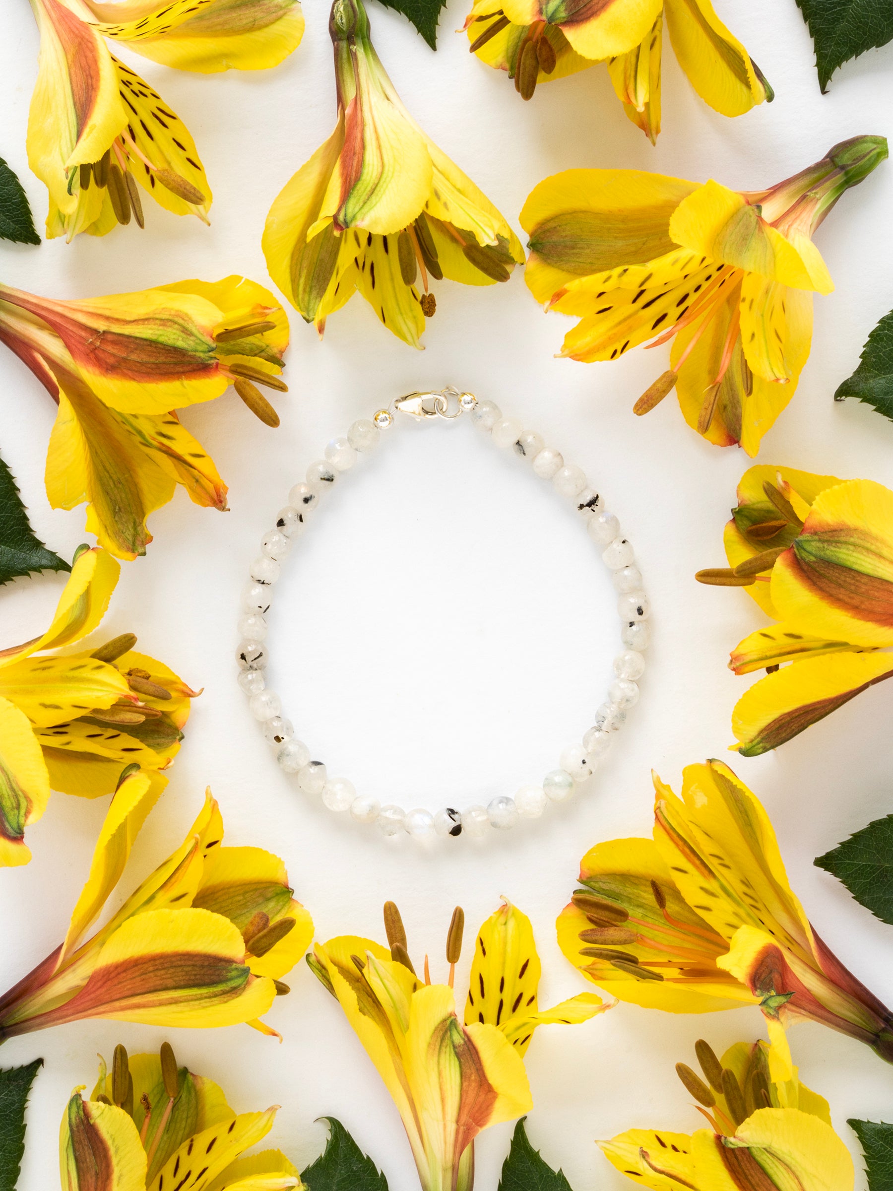 One-of-a-kind natural crystal designer bracelet with sterling silver hardware, designed & handmade in California. Crystals include Black Tourmaline &
Rainbow Moonstone.