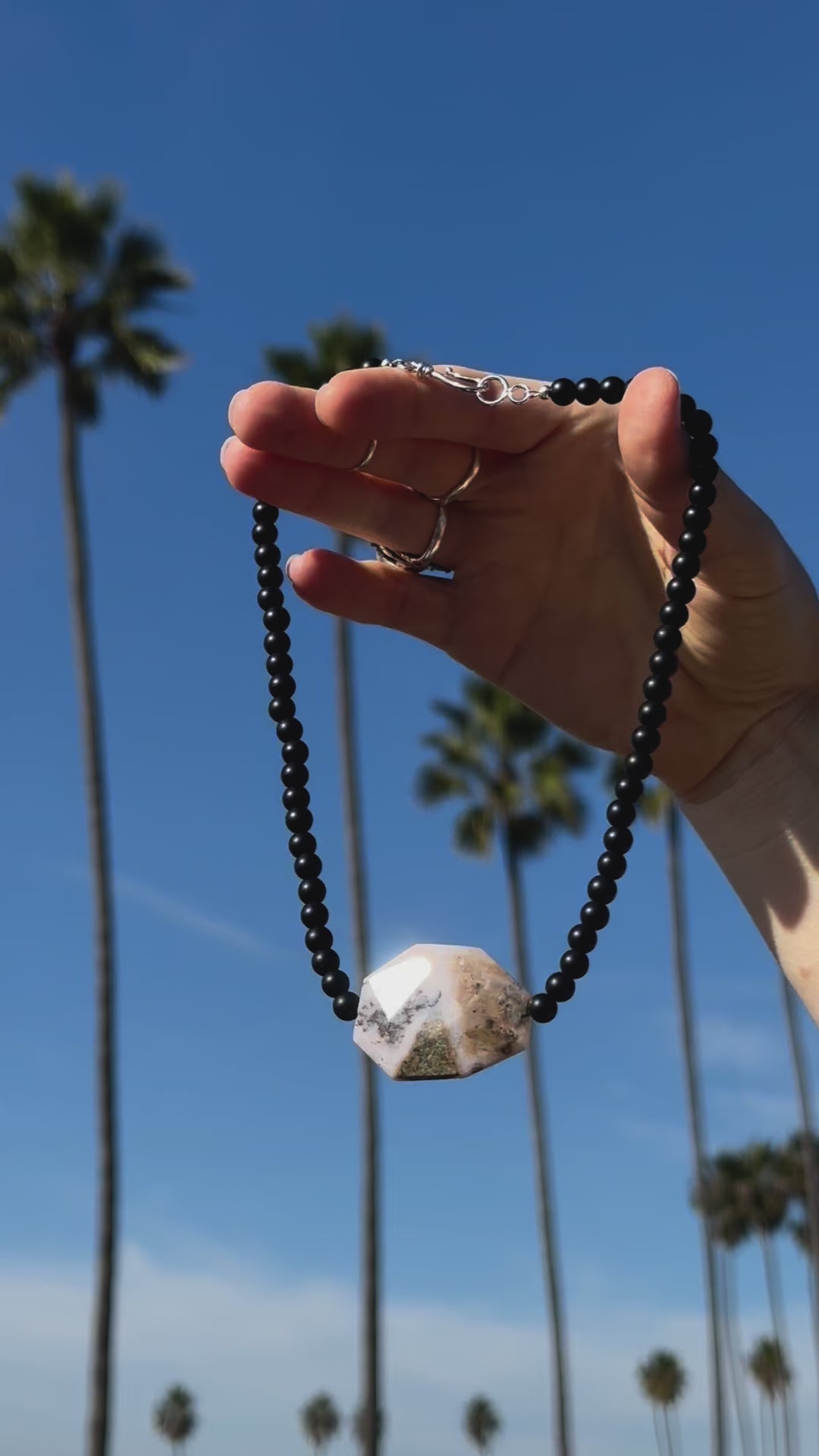 One-of-a-kind natural crystal designer bracelet with sterling silver hardware, designed & handmade in California. Crystals include Black Lava Rock &
Rhodonite.