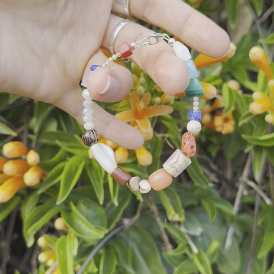 One-of-a-kind natural crystal, stone, & shell designer bracelet with sterling silver hardware, designed & handmade in California. Crystals, stones, & shells include African Opal Jasper, Antique Mediterranean Red Coral, Blue Lapis, Blue Opal, Buri Seed (from the Buri Palm tree), Coconut Shells, Freshwater Pearl, Malachite, Morganite, Mother of Pearl, Natural Shells, Pink Coral, Rhodochrosite, & Rose Quartz.