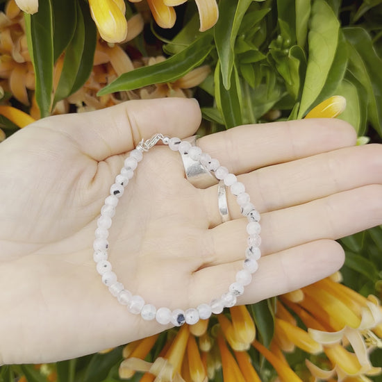 One-of-a-kind natural crystal designer bracelet with sterling silver hardware, designed & handmade in California. Crystals include Black Tourmaline &
Rainbow Moonstone.