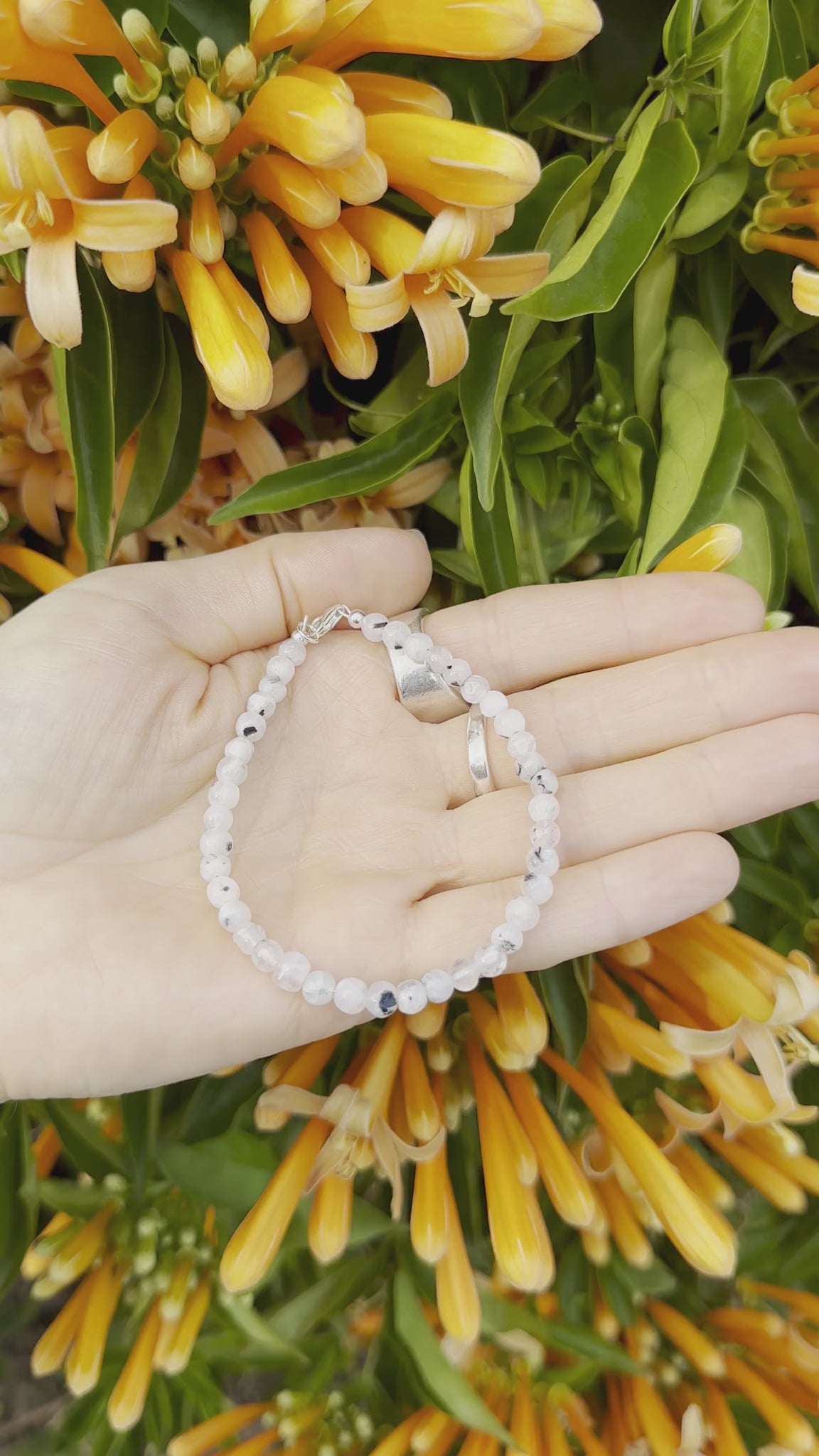 One-of-a-kind natural crystal designer bracelet with sterling silver hardware, designed & handmade in California. Crystals include Black Tourmaline &
Rainbow Moonstone.