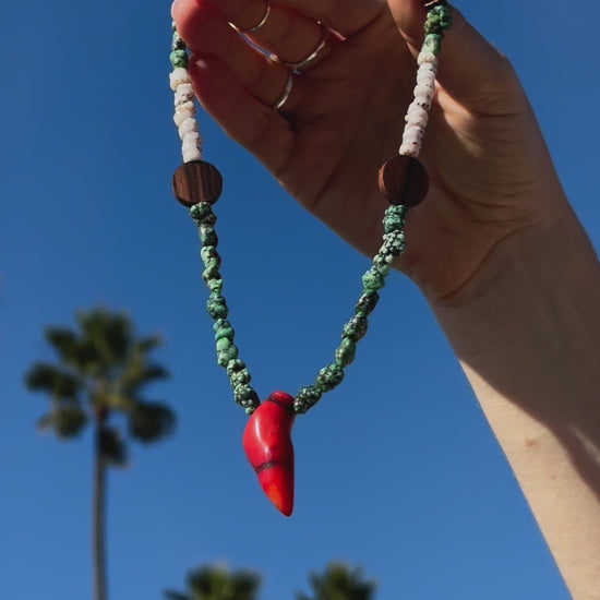 One-of-a-kind natural stone, shell, & wood designer bracelet with sterling silver hardware, designed & handmade in California. Stones & shells include Coconut Shells, Natural Puka Shells, Red Coral, & Turquoise.