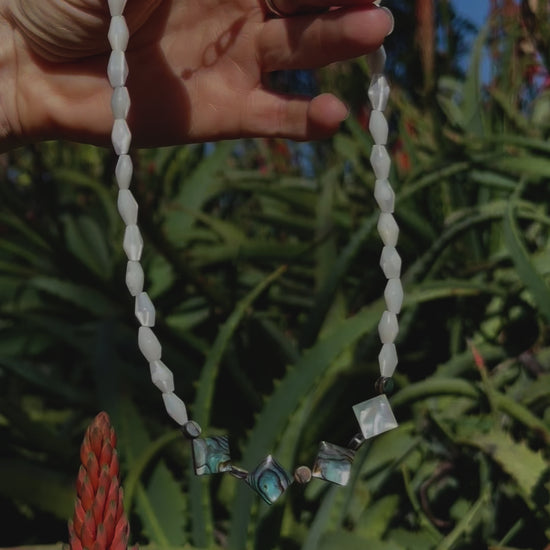 One-of-a-kind natural shell designer necklace with sterling silver hardware, designed & handmade in California. Shells include Mother of Pearl & Abalone.