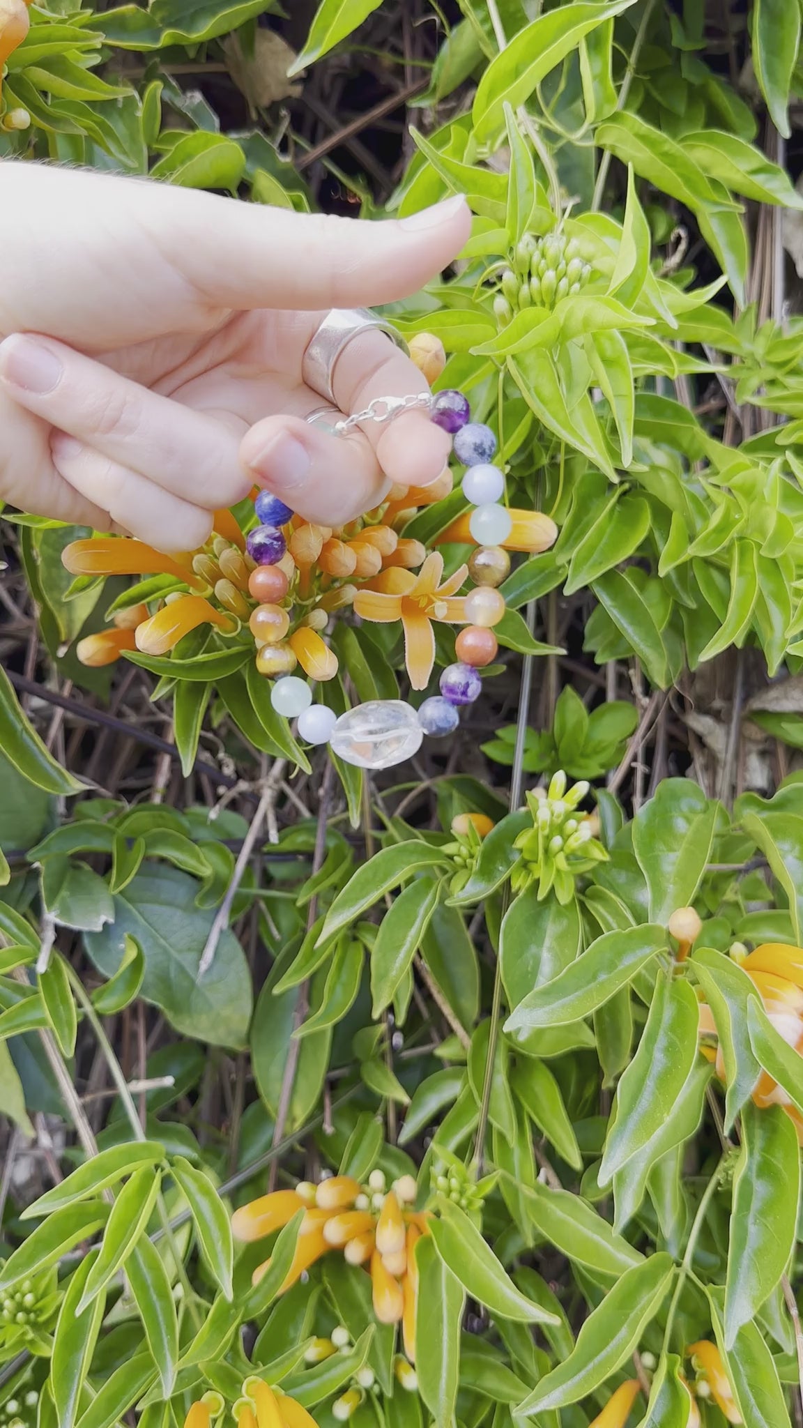 One-of-a-kind Amethyst, Aventurine, Blue Calcite, Blue Lapis, Carnelian, Quartz, Red Jasper, & Tiger's Eye designer bracelet with sterling silver hardware, designed & handmade in California.