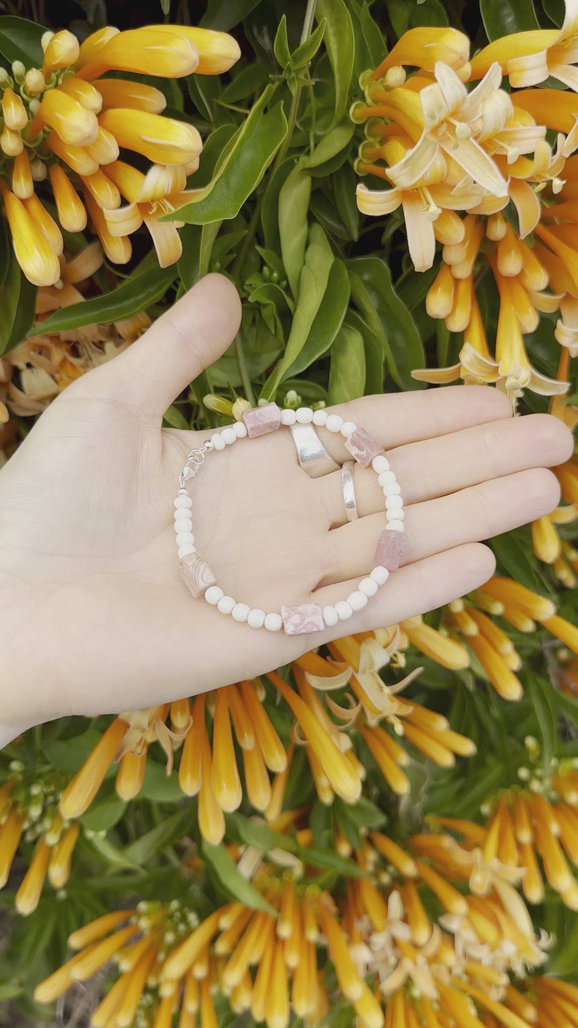 One-of-a-kind natural crystal & cow bone designer bracelet with sterling silver hardware, designed & handmade in California. Crystals are Rhodochrosite.