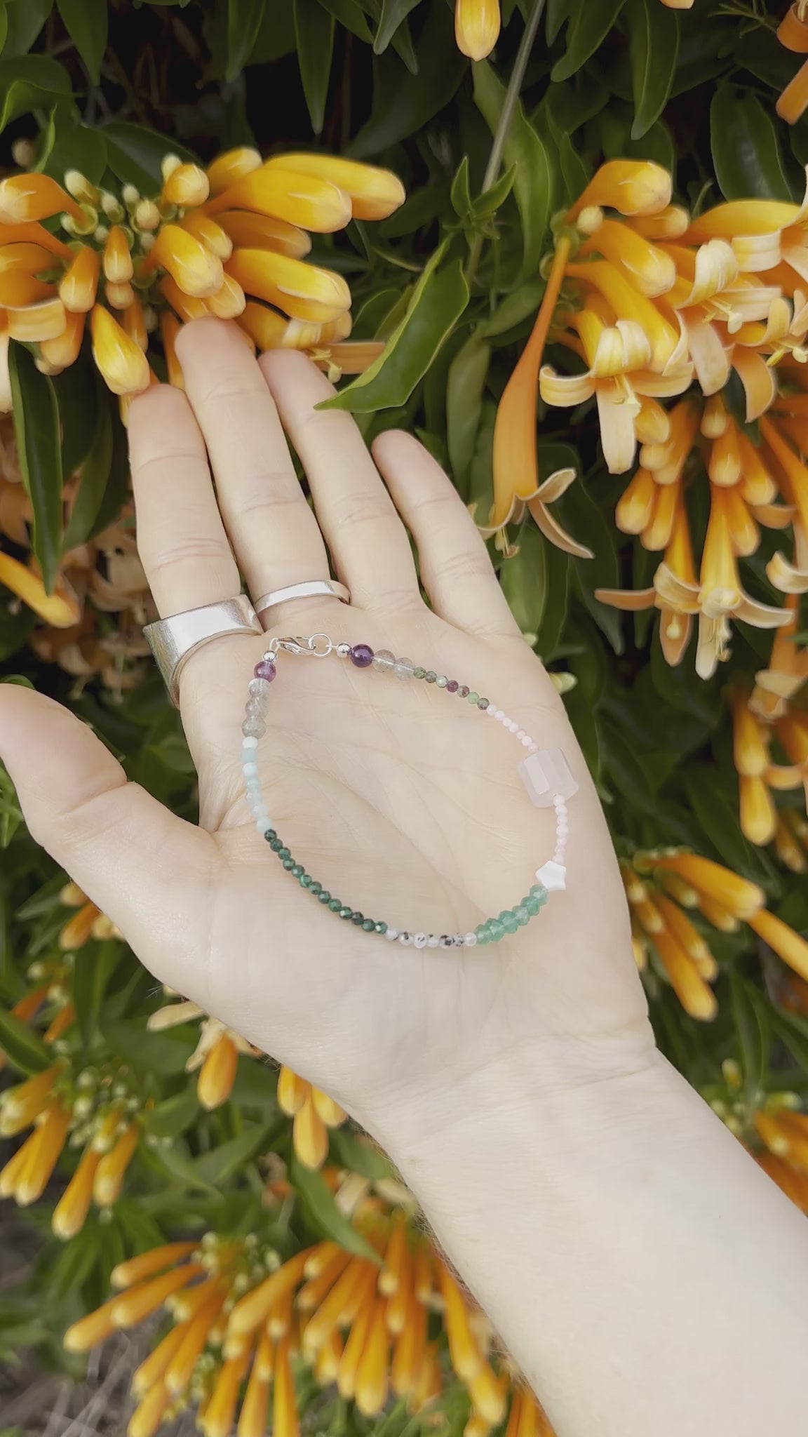 One-of-a-kind Amazonite, Amethyst, Aventurine, Labradorite, Malachite, Moonstone, Mother of Pearl, Pink Coral, Rose Quartz, & Ruby Zoisite designer bracelet with sterling silver hardware, designed & handmade in California.