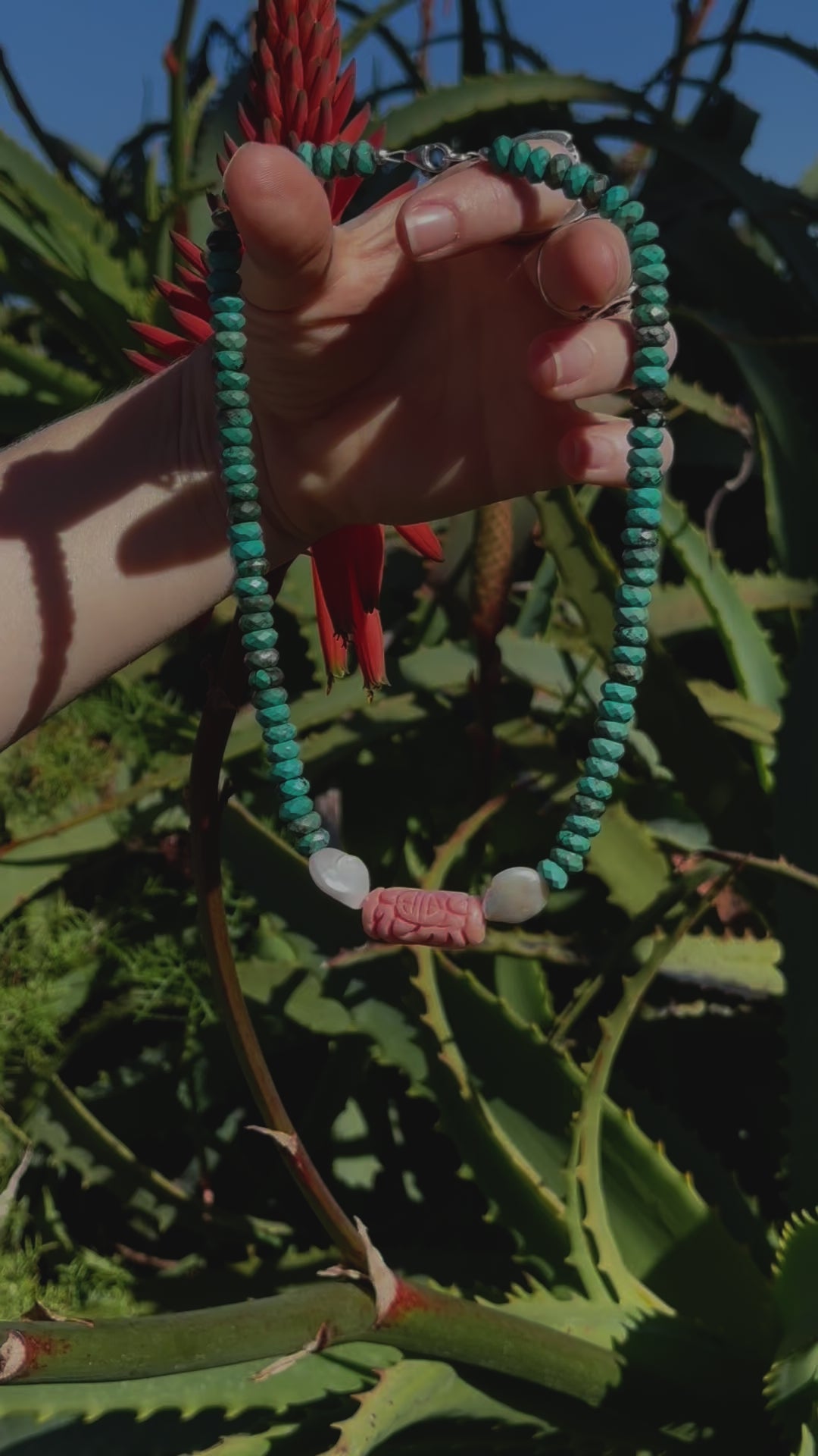 One-of-a-kind natural crystal & stone designer bracelet with sterling silver hardware, designed & handmade in California. Stones are Freshwater Pearls, Pink Coral, & Turquoise.