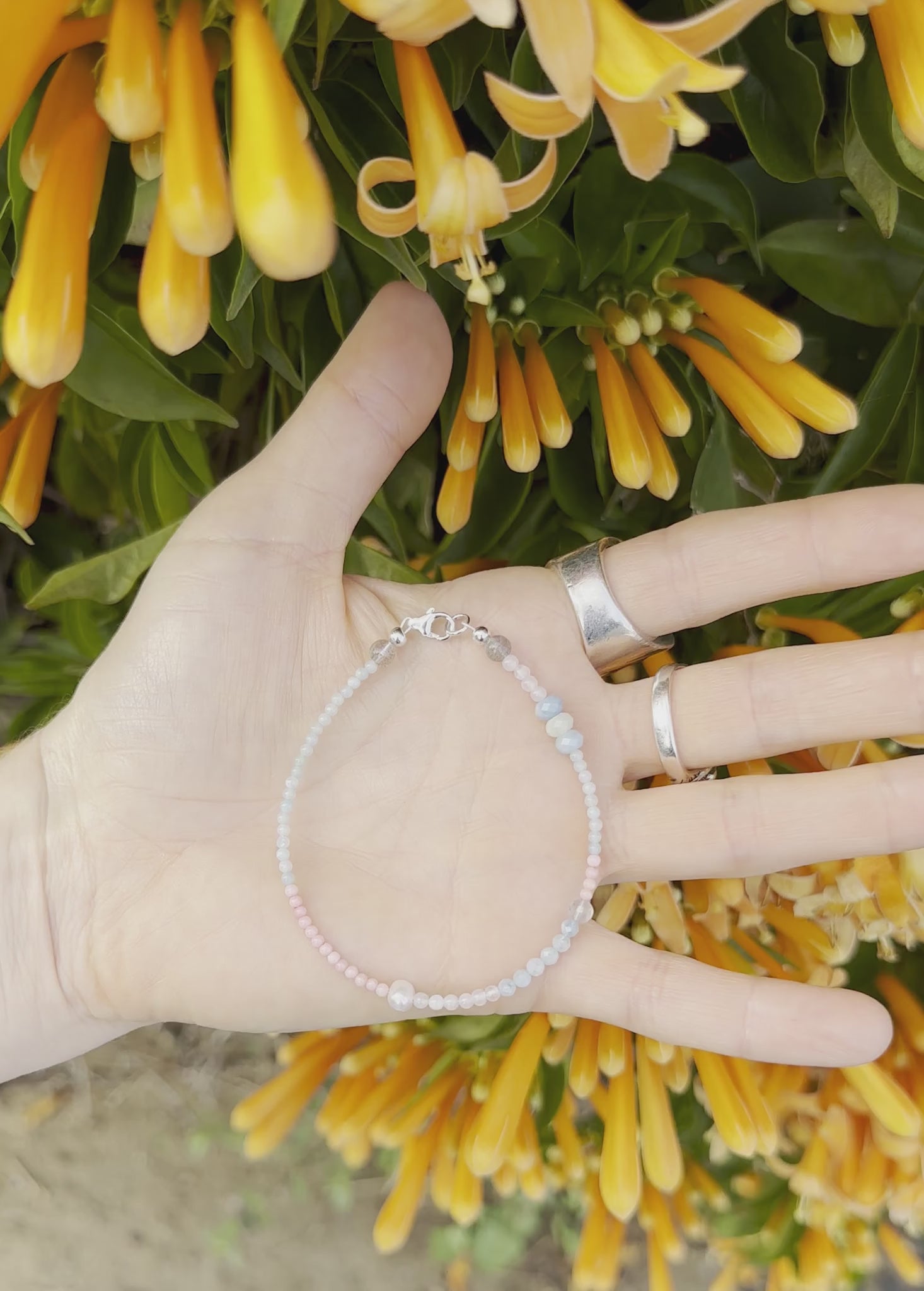 One-of-a-kind natural crystal designer bracelet with sterling silver hardware, designed & handmade in California. Stones are Amazonite, Freshwater Pearl, Labradorite, Morganite, Pink Coral, & Rose Quartz.