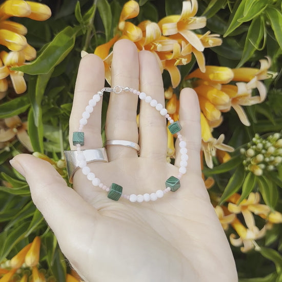 One-of-a-kind natural Pink Coral, Malachite, & Mother of Pearl designer bracelet with sterling silver hardware, designed & handmade in California.