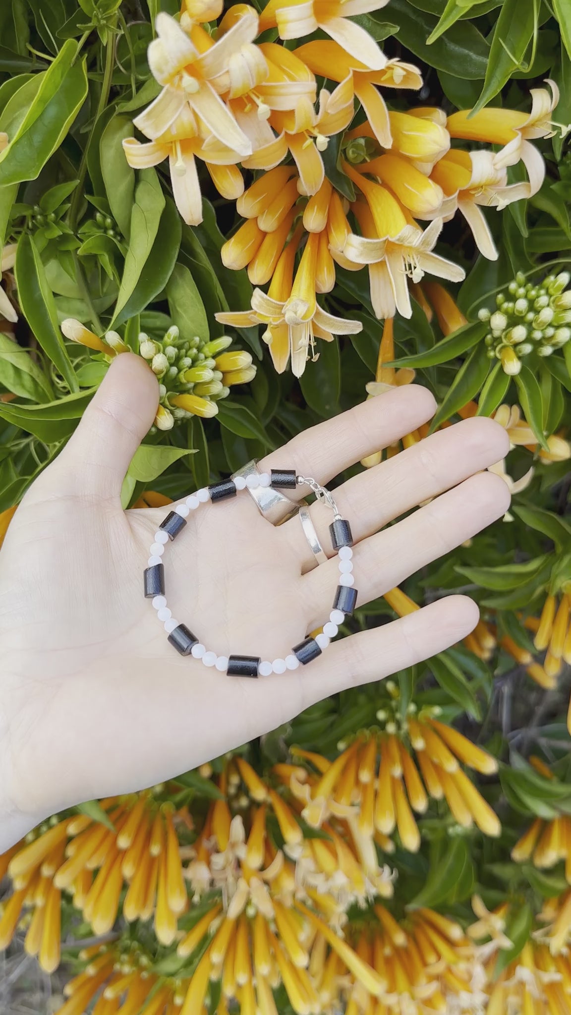 One-of-a-kind natural Black Coral & Mother of Pearl designer bracelet with sterling silver hardware, designed & handmade in California.